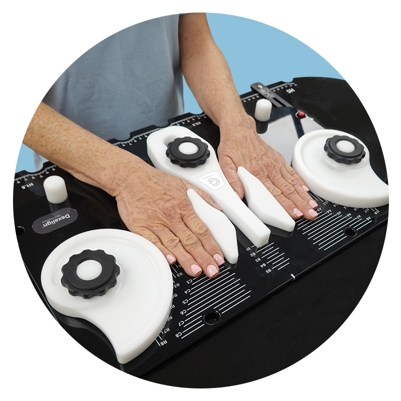 patient with hands immobilized in dexalign hand positioner