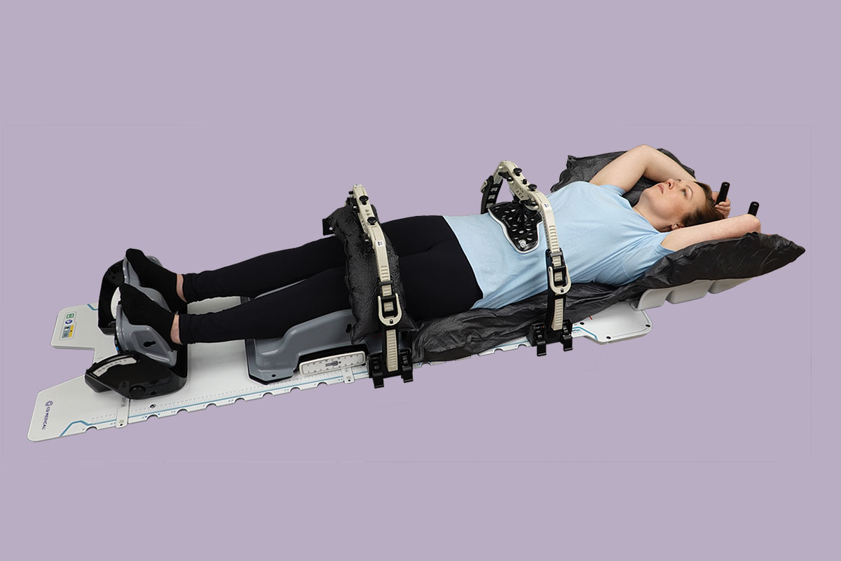 patient on alta multipurpose device with two body pro-lok bridges