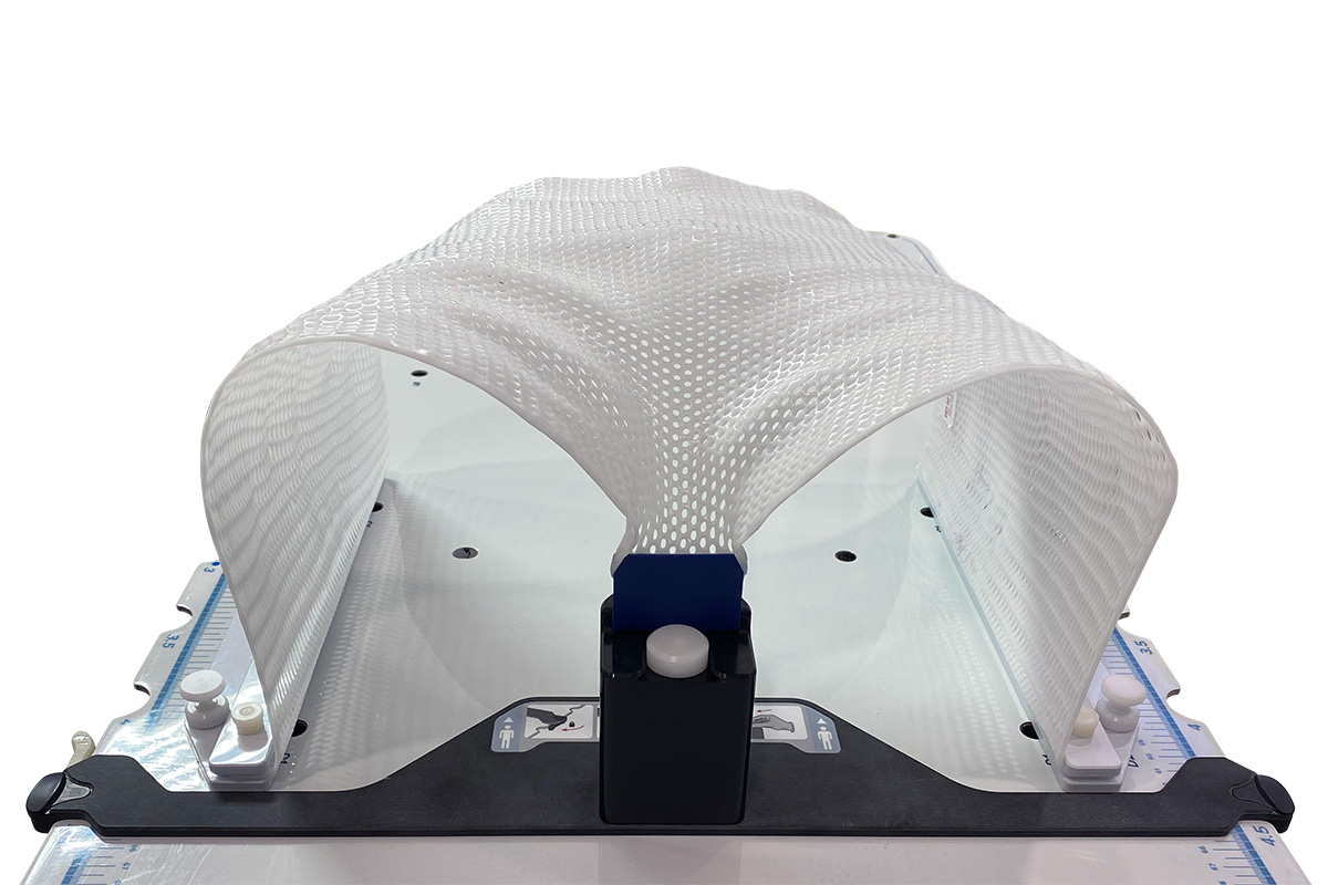 Alta Pelvis thermoplastic with Groin Lock. Alta Groin Lock is used in conjunction with Opti-Handles to secure thermoplastic to the Alta device, to increase the reproducibility and precision of immobilization for pelvic setups.