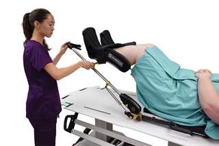 Therapist adjusting Alpine Stirrup